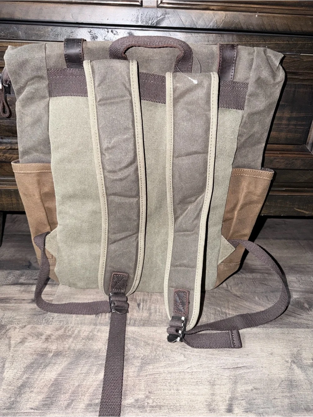 Waxed Canvas Roll-Top Backpack in army green and Brown